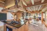 This stunning kitchen boasts a rustic yet modern design, perfect for those seeking a blend of comfort and style.