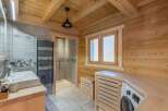 Step into this stunning bathroom, where rustic charm meets modern convenience.