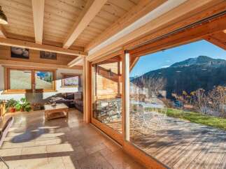 Experience the epitome of alpine living in this stunning property, boasting a seamless blend of indoor and outdoor spaces.