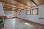 Discover the charm of this inviting living space, featuring a stunning wooden ceiling and exposed beams that add warmth and character.