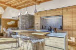 This stunning kitchen showcases a modern design with a rustic touch, perfect for a luxurious living experience.