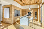 This stunning kitchen showcases a modern design with a rustic touch, perfect for a luxurious living experience.