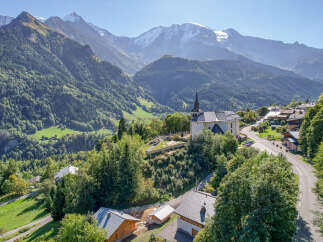 Nestled in a picturesque mountain village, this property offers stunning views of the surrounding peaks.