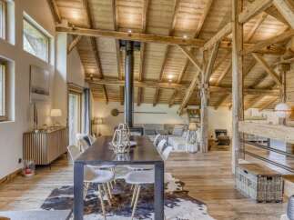 Experience rustic elegance in this stunning property, featuring exposed wooden beams and a cozy fireplace.