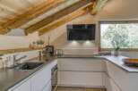 This stunning kitchen features a rustic, yet modern design, perfect for any home.