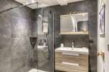Discover modern elegance in this stunning bathroom! Featuring a sleek glass shower, a stylish vanity with ample storage, and beautiful tile work, this space is designed for both functionality and luxury.