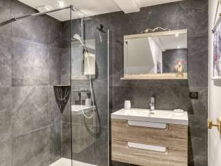 Discover modern elegance in this stunning bathroom! Featuring a sleek glass shower, a stylish vanity with ample storage, and beautiful tile work, this space is designed for both functionality and luxury.