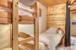 Cozy and inviting, this bedroom features a charming bunk bed, perfect for accommodating guests or family.