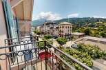 Enjoy breathtaking views from this charming property! This home features a balcony overlooking a picturesque street and stunning mountain scenery.