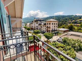 Enjoy breathtaking views from this charming property! This home features a balcony overlooking a picturesque street and stunning mountain scenery.