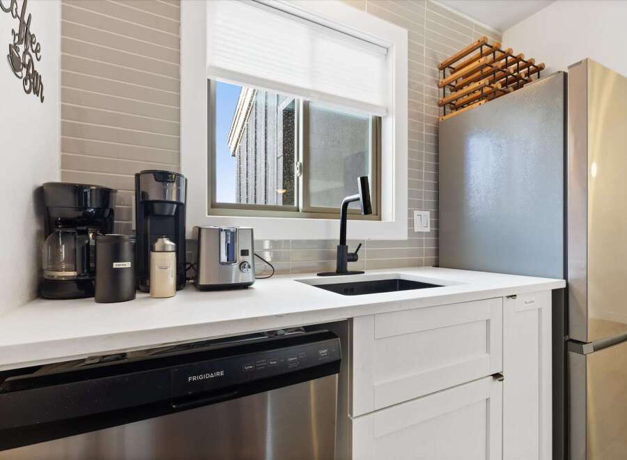 This stunning kitchen boasts modern appliances and stylish design.