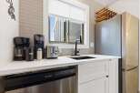 This stunning kitchen boasts modern appliances and stylish design.