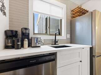 This stunning kitchen boasts modern appliances and stylish design.