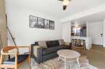 This stunning property boasts a modern living space with a cozy atmosphere.