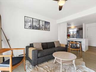 This stunning property boasts a modern living space with a cozy atmosphere.
