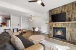 Step into this inviting living space, featuring a cozy fireplace and a modern design.