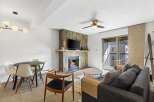 This stunning property features a cozy living room with a fireplace, perfect for relaxing evenings.