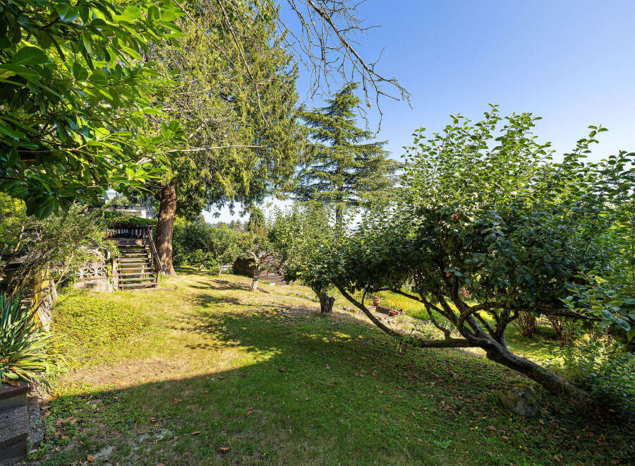 Discover the tranquility of this stunning property, featuring a lush, expansive yard perfect for outdoor enjoyment.