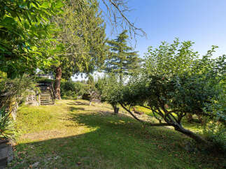 Discover the tranquility of this stunning property, featuring a lush, expansive yard perfect for outdoor enjoyment.