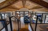 Experience luxury living in this stunning chalet, boasting a spacious open-plan design with a vaulted wooden ceiling.