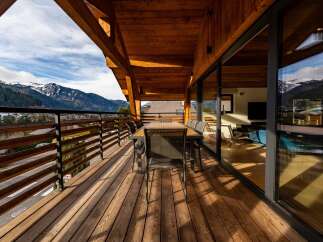 Enjoy breathtaking mountain views from this stunning balcony.