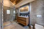 Step into luxury with this stunning bathroom featuring a modern design and high-end finishes.