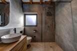 Step into modern luxury with this stunning bathroom design.