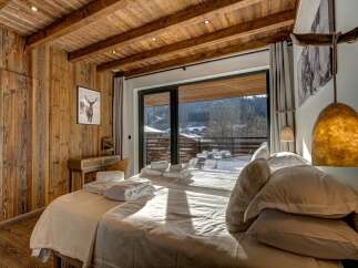 Experience rustic elegance in this stunning bedroom.