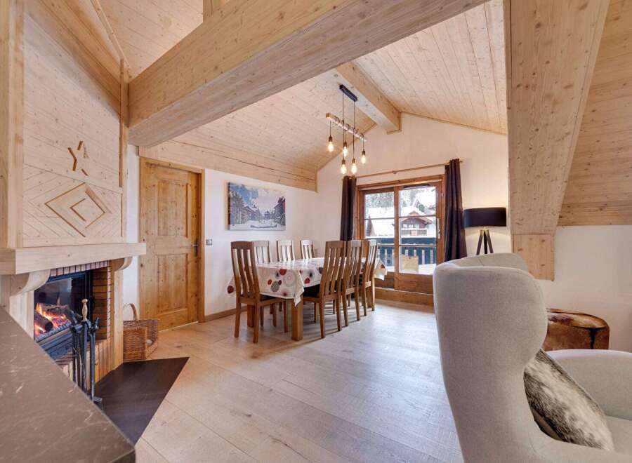 Experience the warmth and charm of this stunning property, featuring a cozy fireplace and inviting wooden accents throughout.