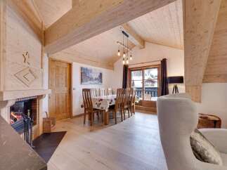 Experience the warmth and charm of this stunning property, featuring a cozy fireplace and inviting wooden accents throughout.