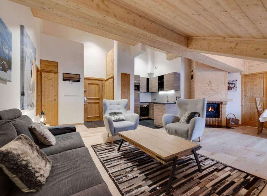 Experience the warmth of this stunning living space, featuring a cozy fireplace and inviting seating areas.