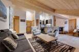 Experience the warmth of this stunning living space, featuring a cozy fireplace and inviting seating areas.