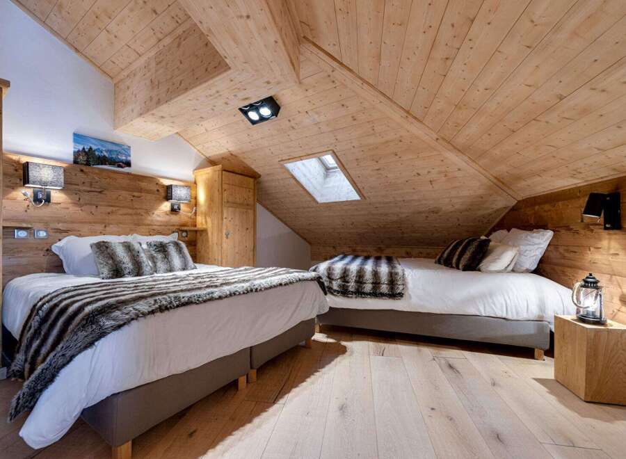 This cozy bedroom features a rustic wooden design, creating a warm and inviting atmosphere.