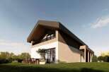 This modern home boasts a striking architectural design with a unique roofline and a blend of natural materials.