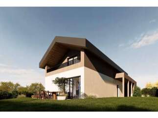 This modern home boasts a striking architectural design with a unique roofline and a blend of natural materials.