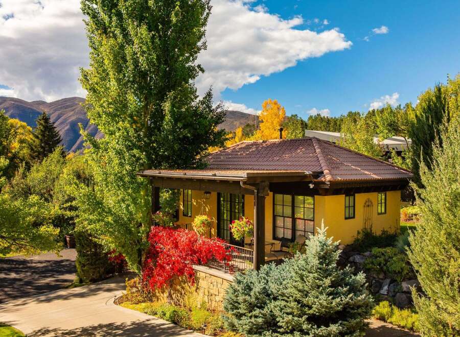 Nestled amidst lush greenery and stunning mountain views, this charming property offers a serene escape.