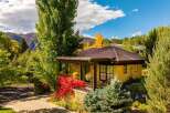Nestled amidst lush greenery and stunning mountain views, this charming property offers a serene escape.