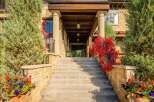 Step into luxury with this stunning property, showcasing an inviting entrance with a grand staircase.