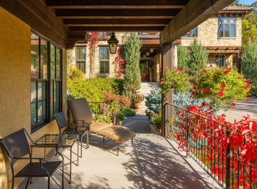 Enjoy the charm of this stunning property, featuring a beautifully designed porch perfect for relaxation.