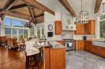 Experience luxury living in this stunning kitchen! Featuring a gourmet Wolf range, custom cabinetry, and a spacious island, this kitchen is perfect for both cooking and entertaining.