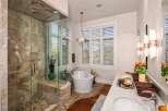Step into luxury with this stunning bathroom! Featuring a spacious walk-in shower with beautiful tile work and a modern glass enclosure, this bathroom is a true oasis.