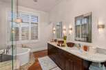 Step into luxury with this stunning bathroom featuring a spacious vanity with dual sinks and a beautiful countertop.