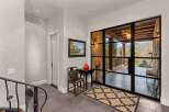 Step into luxury with this stunning entryway, showcasing a blend of modern and classic design.