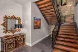 Step into luxury with this stunning property featuring a grand staircase and elegant entryway.