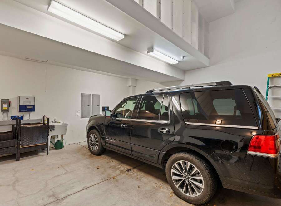 This spacious garage offers ample room for parking and storage, perfect for any homeowner.