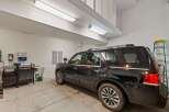 This spacious garage offers ample room for parking and storage, perfect for any homeowner.