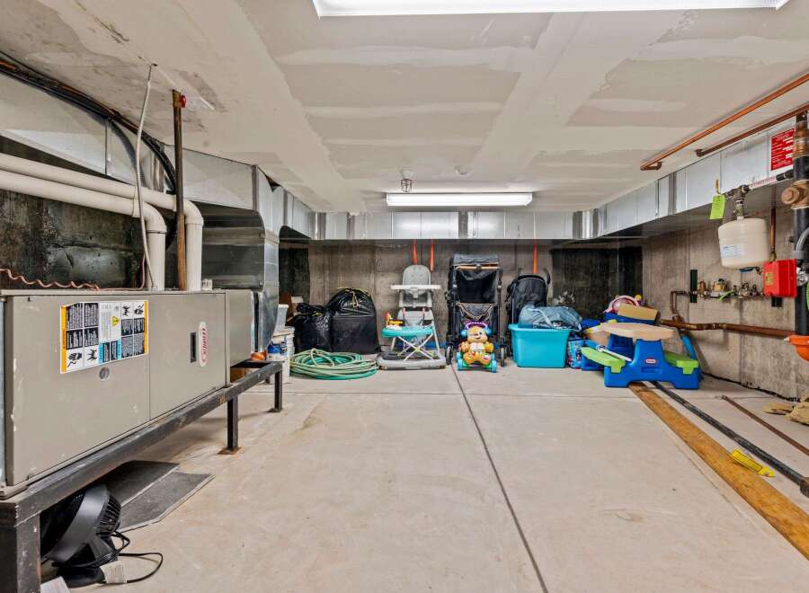 This image showcases a well-maintained basement, perfect for storage or potential renovation.