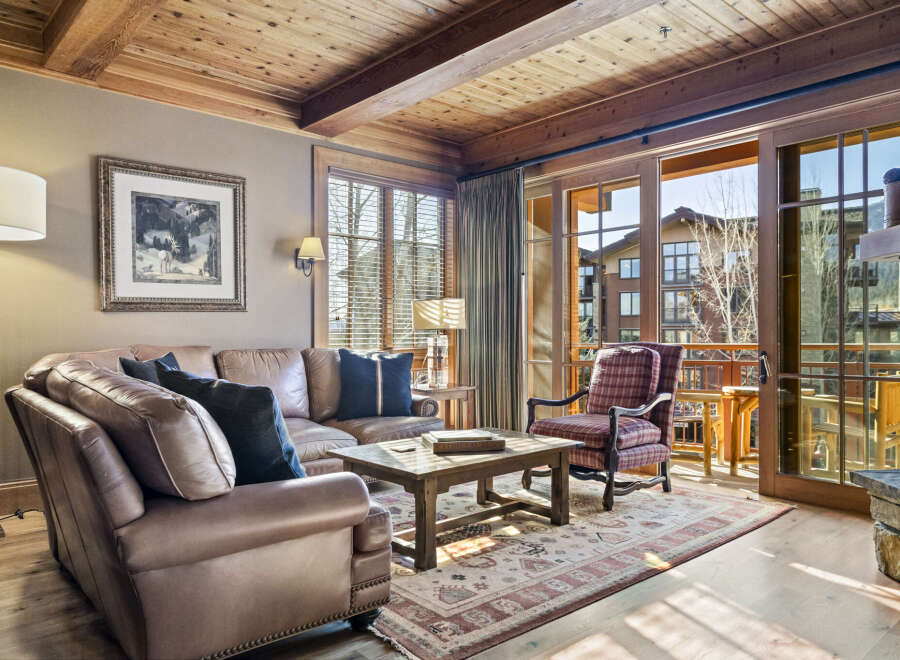 This stunning living room boasts a warm and inviting atmosphere, perfect for relaxation and entertaining.