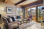 This stunning living room boasts a warm and inviting atmosphere, perfect for relaxation and entertaining.