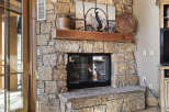 This stunning property boasts a beautiful stone fireplace, perfect for cozy evenings.